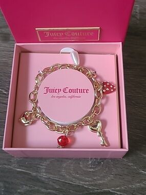 Juicy Couture Gold Charm Bracelet with Red Accents And Strawberry Charm